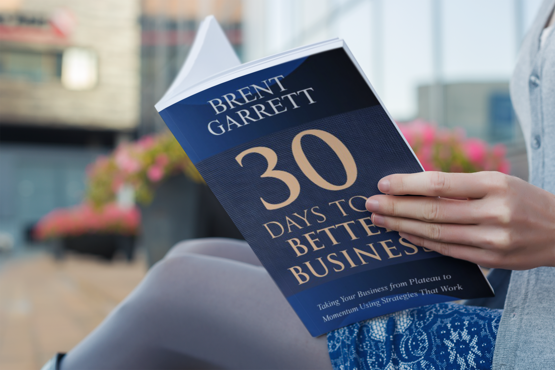 woman reading a book by brent garrett - 30 days to better business